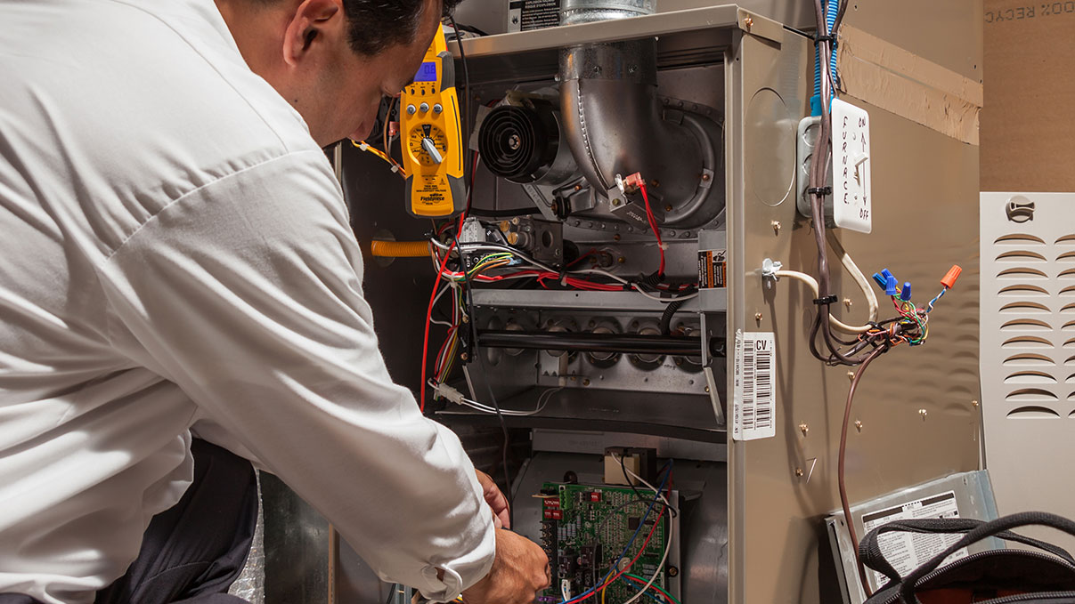 technician repairing heater