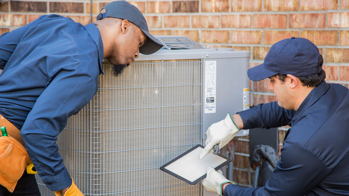 ac technicians installing new unit