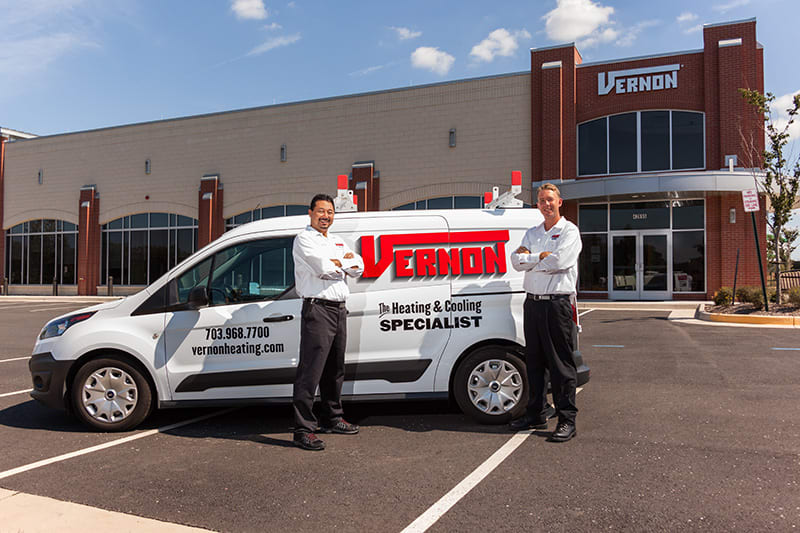 ac techs standing in front of Vernon The Heating &  Cooling Specialist