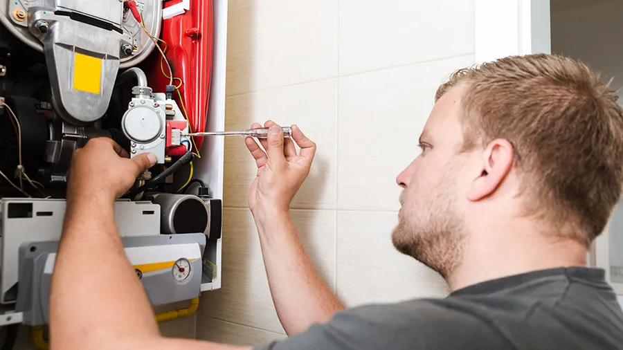 Technician Repairing Furnace